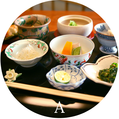 Bowls of Asian food specialties with chop Sticks on a table representing Asian cuisine