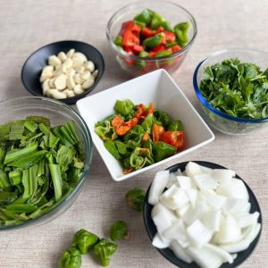 Sofrito ingredients roughly chopped in separate bowls