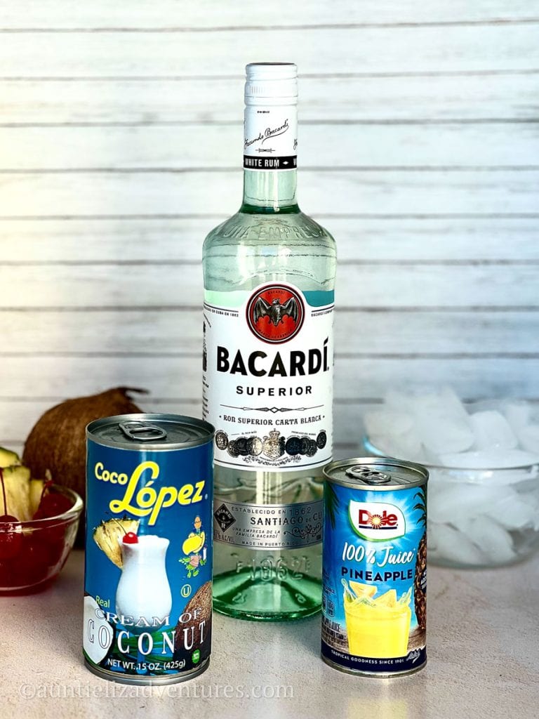 Can of Coco Lopez Cream of Coconut, bottle of Bacardi Rum, and can of Pineapple juice, Ingredients for making a Pina colada